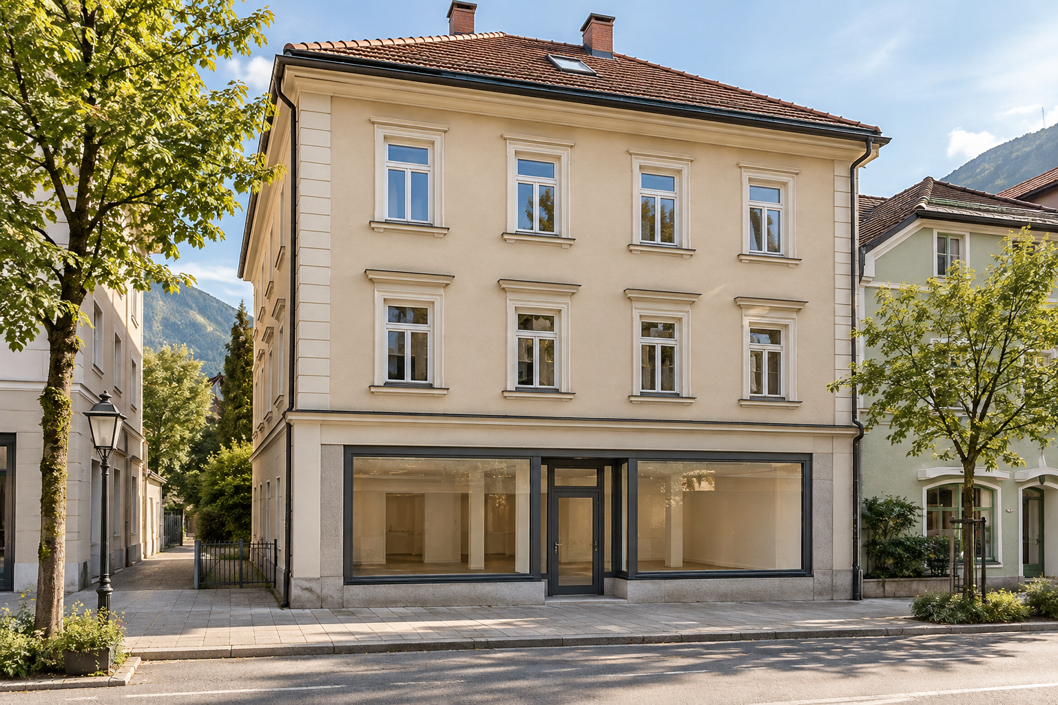 Vollständig sichtbares Stadthaus mit Wohnungen in oberen Stockwerken und Geschäftsfläche im Erdgeschoss